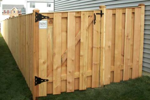 A wooden fence with a gate located in Batavia, IL, highlighting a classic outdoor feature