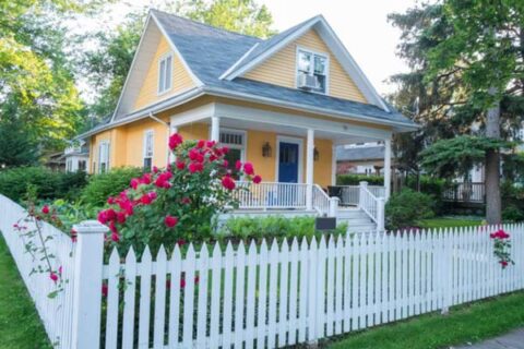 White wooden fencing in front of bungalow, IL