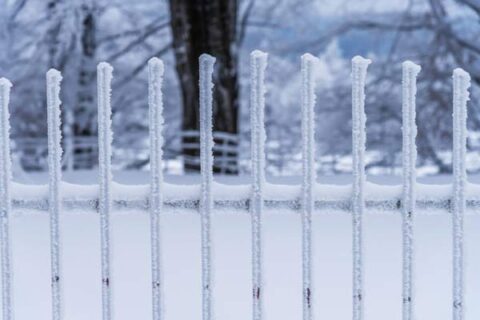 The snow fence in winter at backyard in home