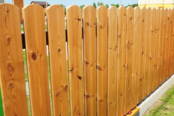 New wooden fence in the garden.