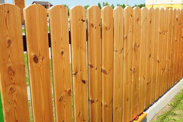 New wooden fence in the garden.