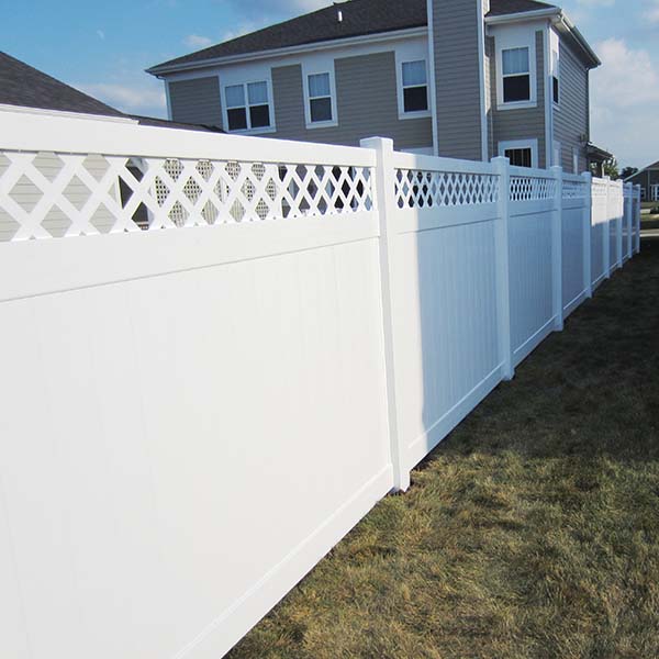 white PVC privacy fence with lattice ont op