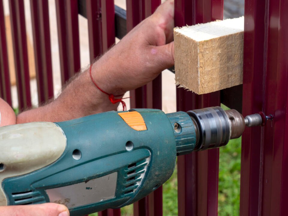 A team member from Paramount Fence provides fence installation service in Chicagoland Suburbs, IL
