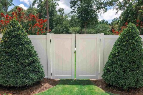 A Residential Recently Installed Vinyl Fencing in a Lawn Area in Chicago, IL