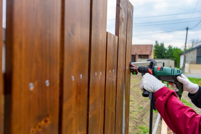 Wooden fence construction showcasing materials that work in the Midwest in Chicagoland, IL